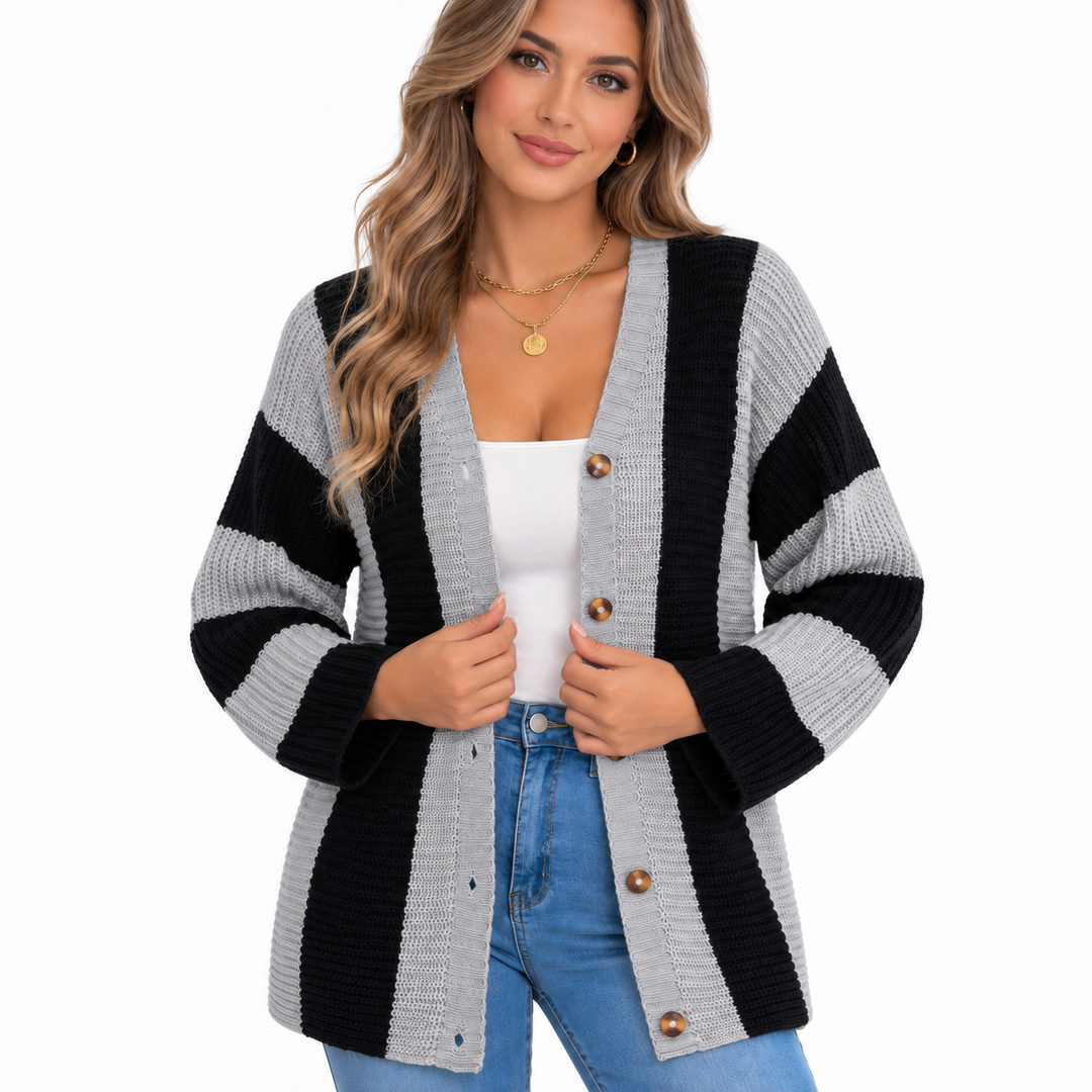 Close view of the grey and black striped cardigan highlighting the chunky knit texture and round brown buttons