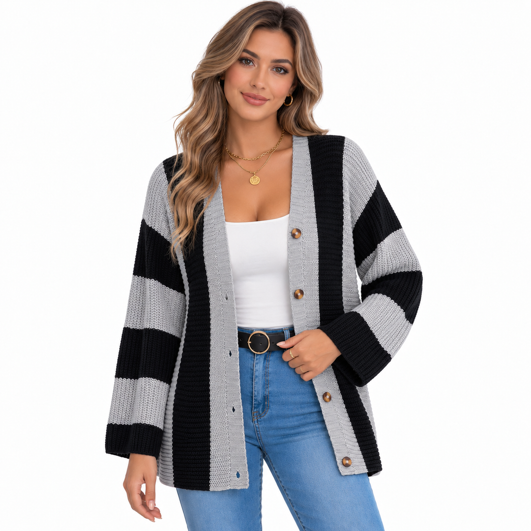 Grey and black striped cardigan for women styled open on a model with jeans against a white studio background