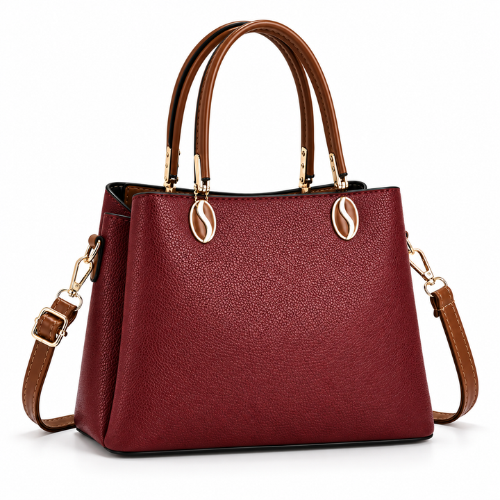 Back of structured burgundy handbag with brown handles
