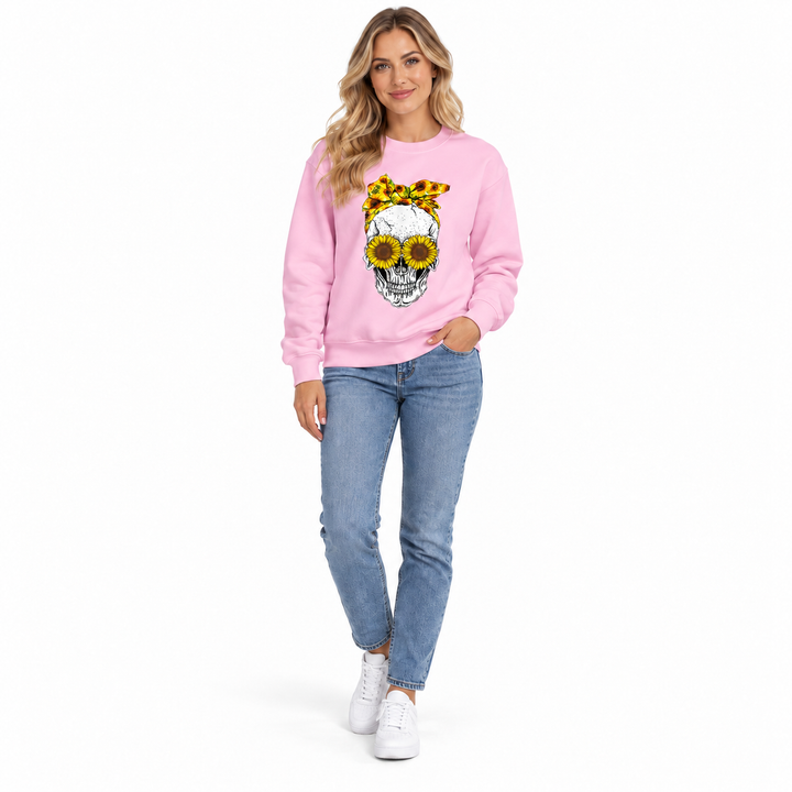 Pink sunflower skull sweatshirt on female model, full-body front view