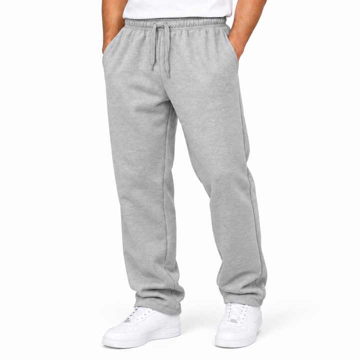 Light gray sweatpants detail showing elastic waistband, drawstring, pocket opening and leg shape