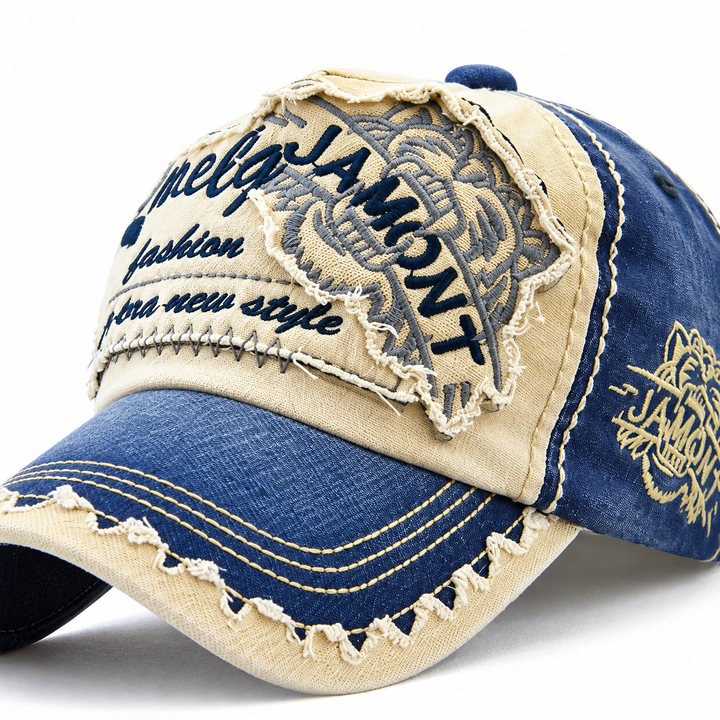 Close-up of tiger embroidery, stitching and distressed brim detail