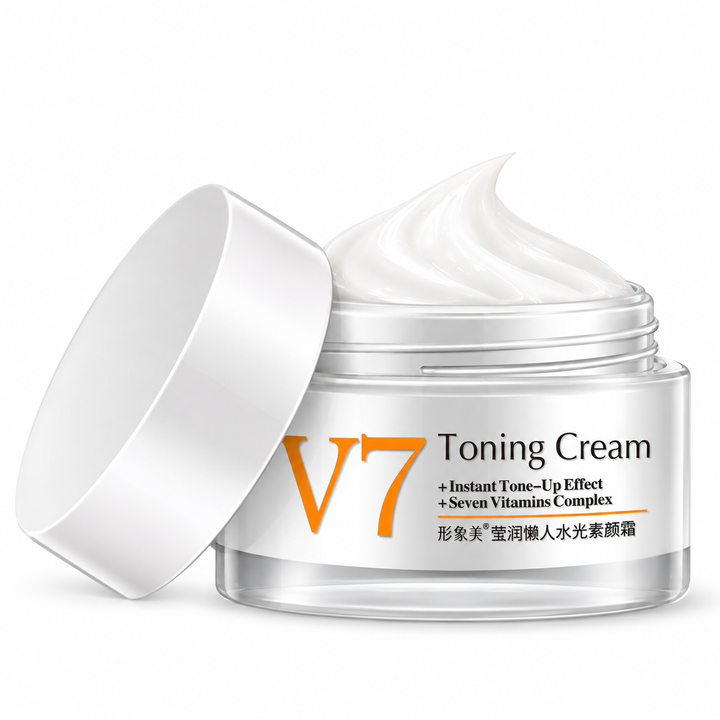 Close view of white cream inside an open V7 Toning Cream jar, showing the cream peak and silver rim against a white backdrop.