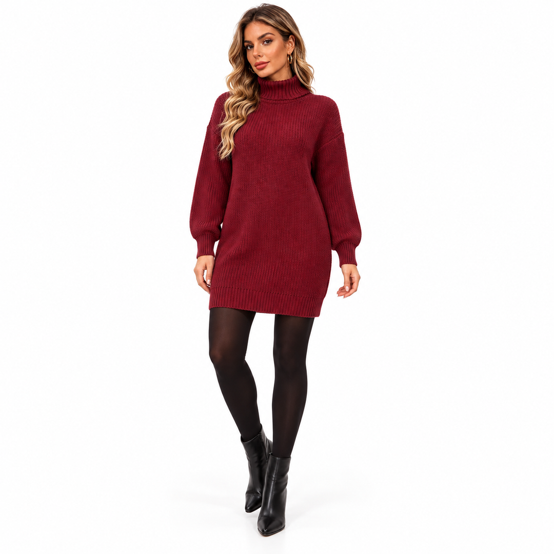 Full-length model wearing the burgundy knit dress, showing the rolled high collar, long sleeves and ribbed hem on pure white.