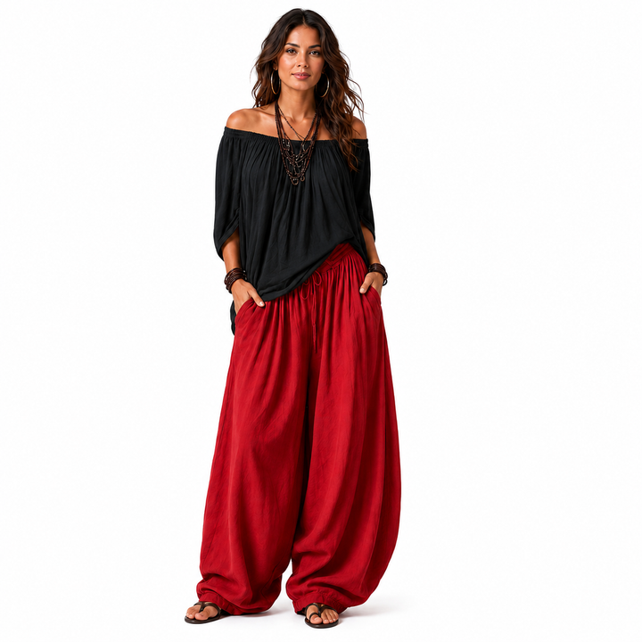 Woman wearing a black off-shoulder top and red gathered pants, full-body catalog view on a white background.