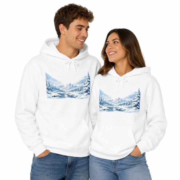 Man and woman wearing matching unisex heavyweight white hoodies with winter landscape print in a clean studio lifestyle pose