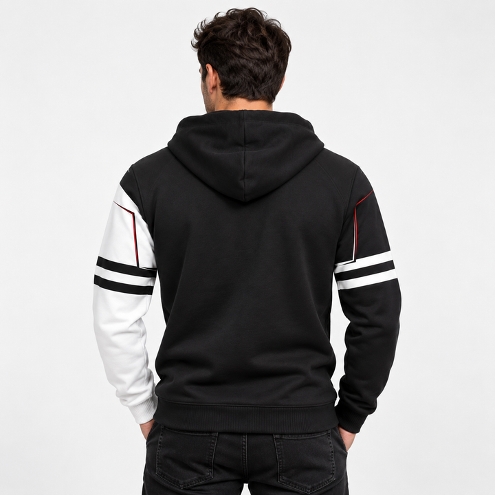 Back view of a male model wearing the unisex keyboard print hoodie with black body, contrast sleeves and striped arm details.