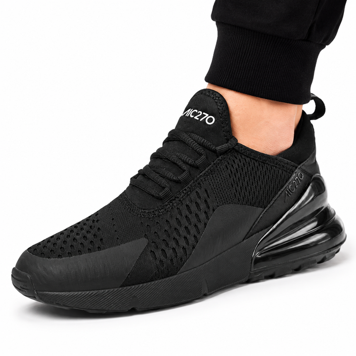 Close-up of black Unisex Max Air running shoe showing the perforated upper, laces and visible heel unit.