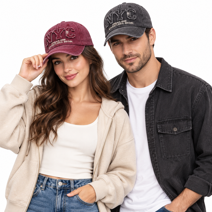 Unisex NYC baseball cap shown on a woman and man in burgundy and charcoal black variants on a white studio background.