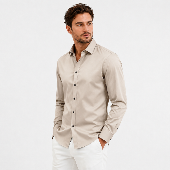 Mens slim fit shirt in apricot on a male model, showing long sleeves, lapel styling and the full fitted shape in angled view.