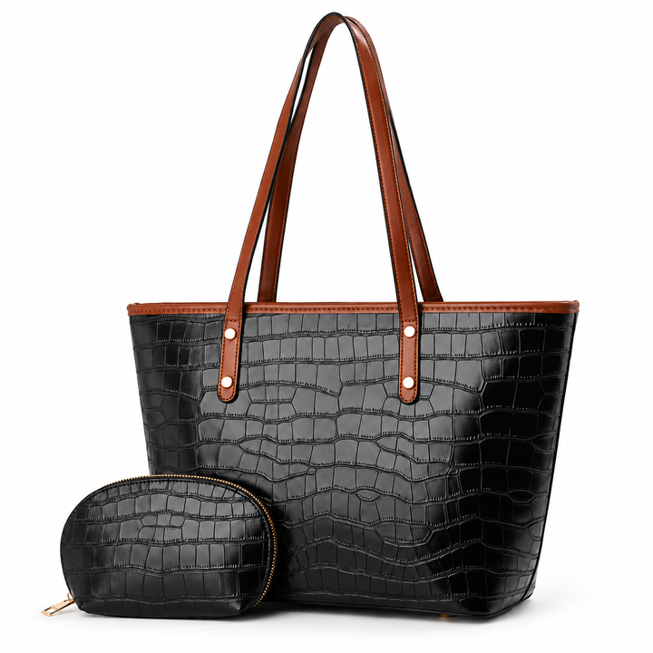 Black crocodile-embossed tote bag with brown handles and matching zip pouch