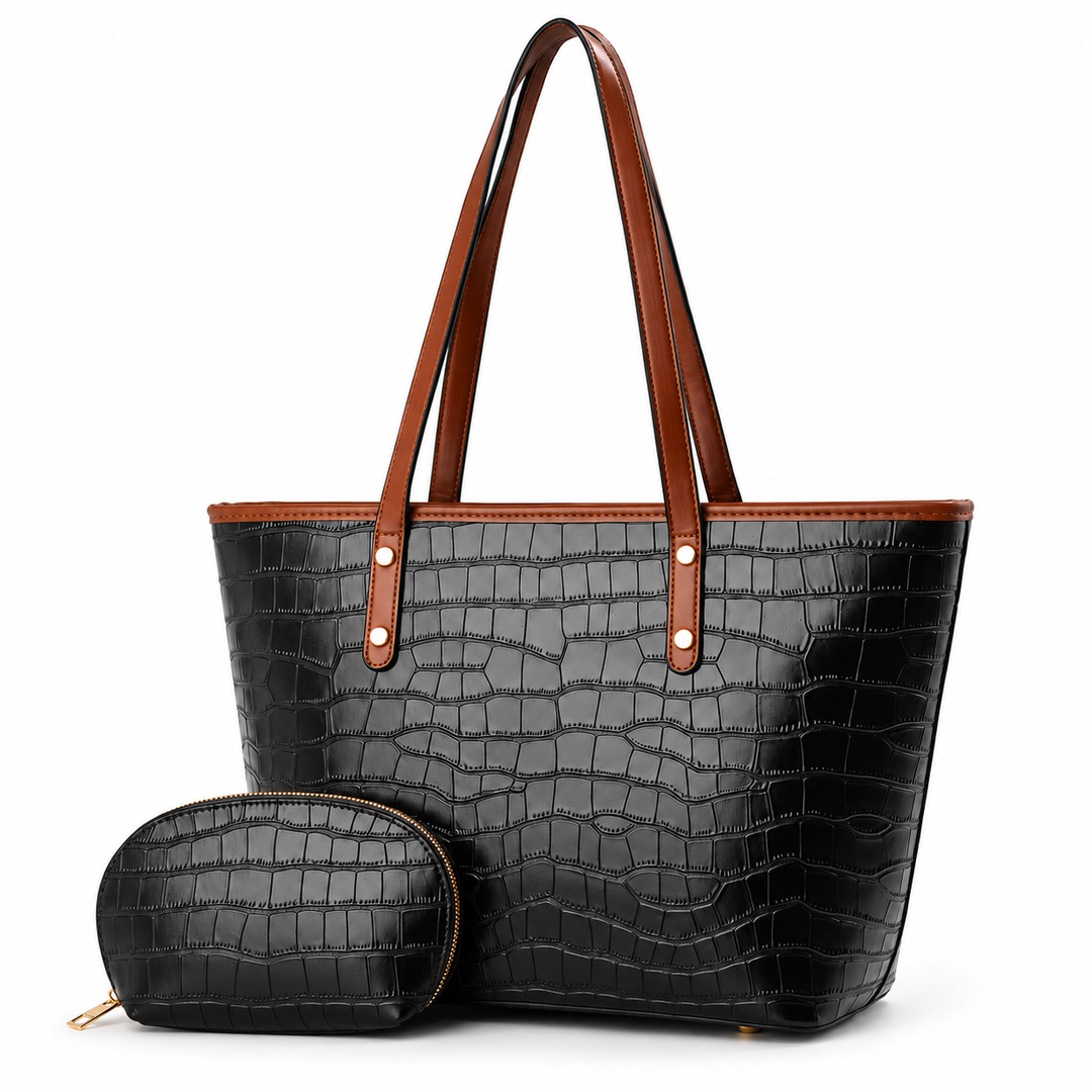 Black crocodile-embossed tote bag with matching pouch in a three-quarter studio view