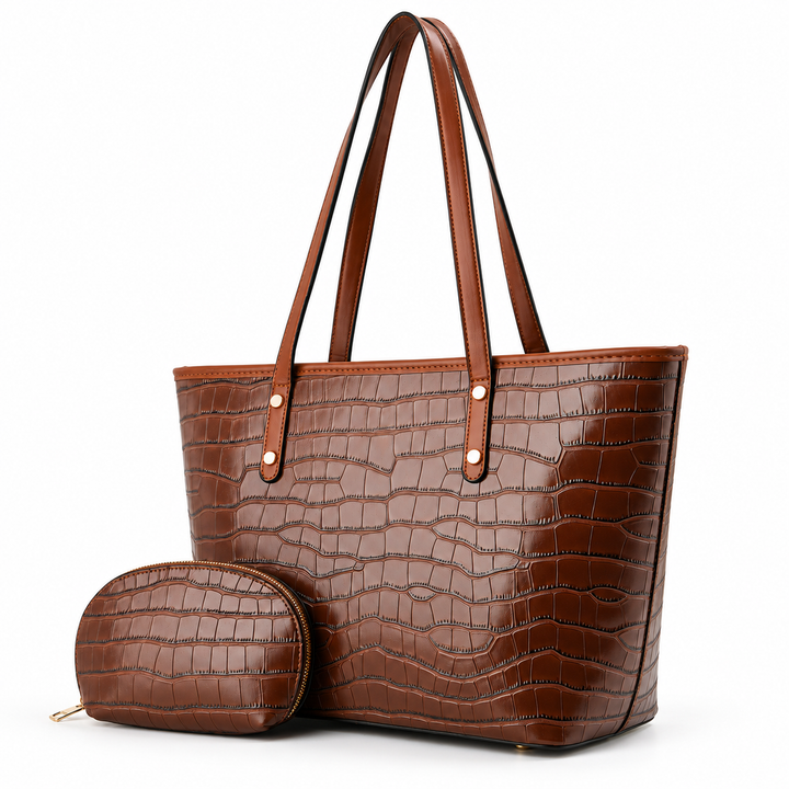 Brown crocodile-embossed tote bag in a three-quarter view with matching zip pouch