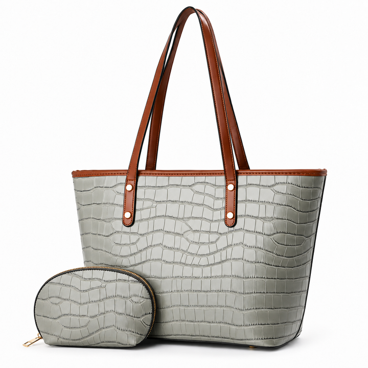 Gray crocodile-embossed tote bag with brown handles and matching zip pouch