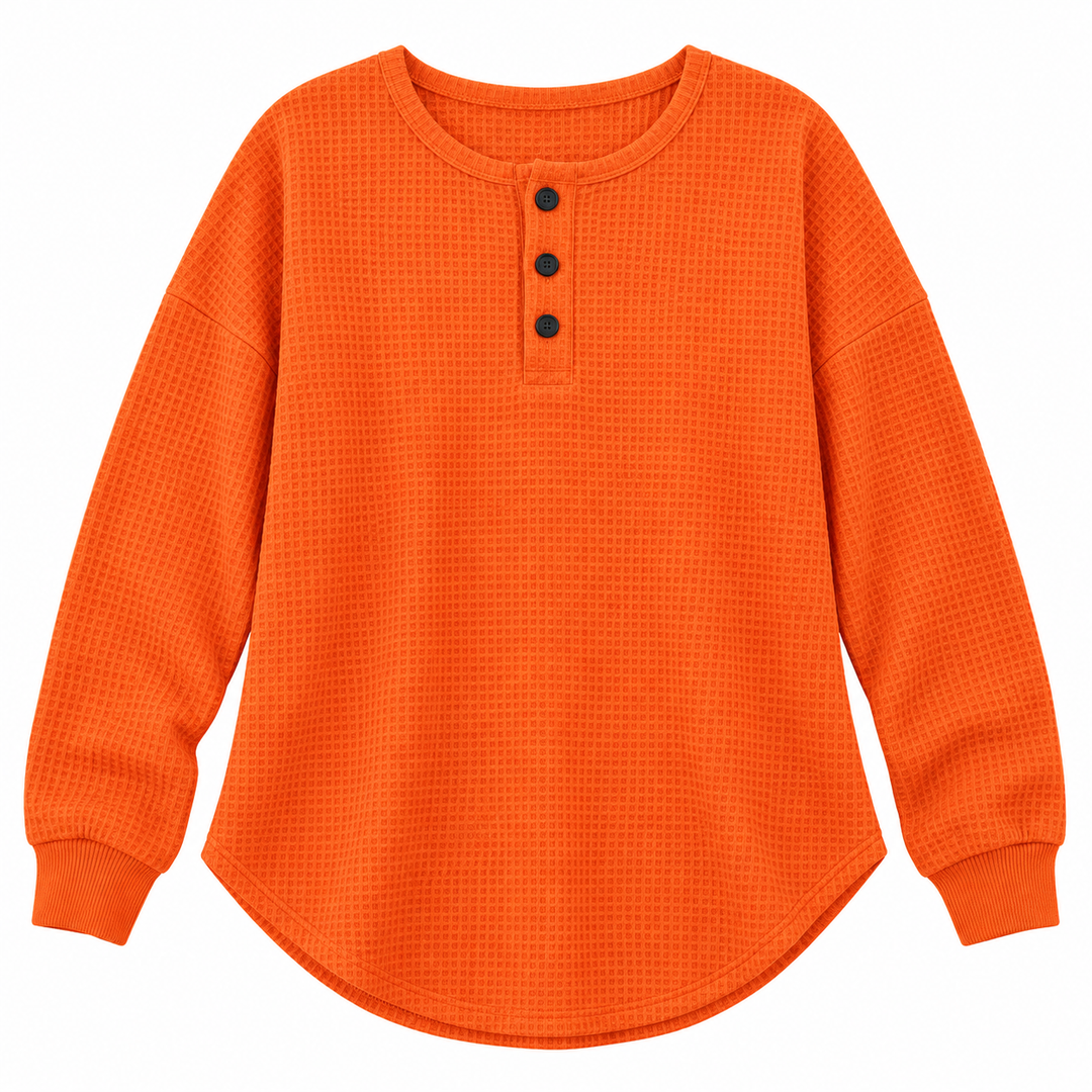 Orange waffle long-sleeve button pullover, flat front view, showing neckline, 3 buttons, textured surface and curved hemline.