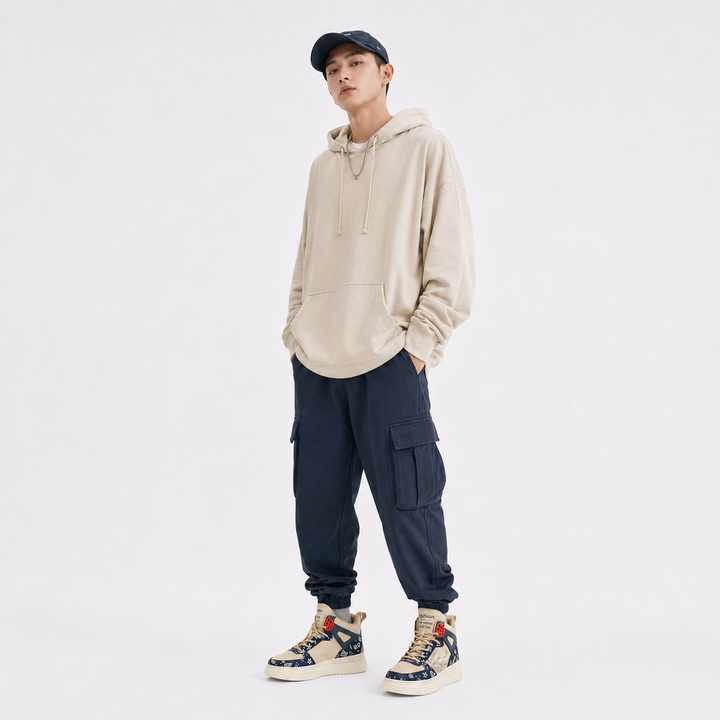 Man wearing beige blue unisex warm athletic high-top shoes on a clean studio background