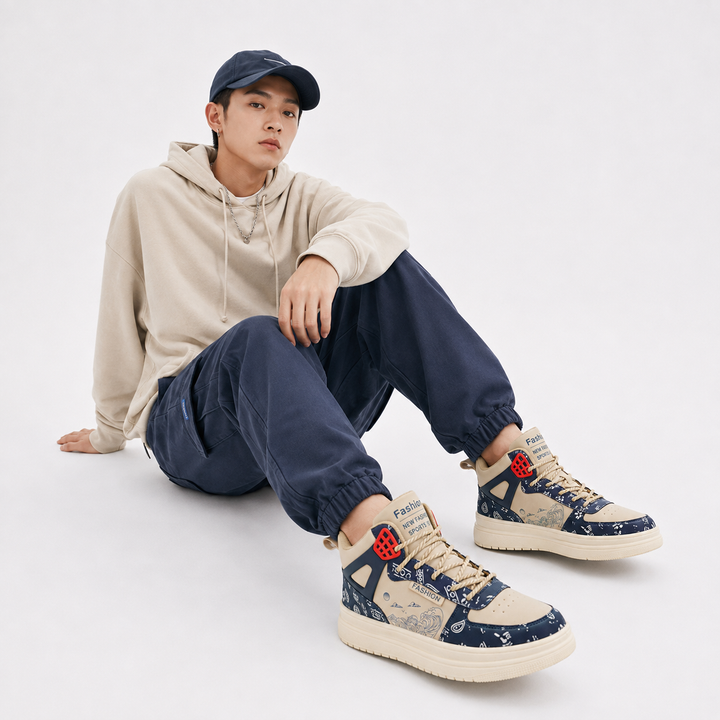 Man seated in studio wearing beige blue unisex warm athletic high-top shoes with product focus