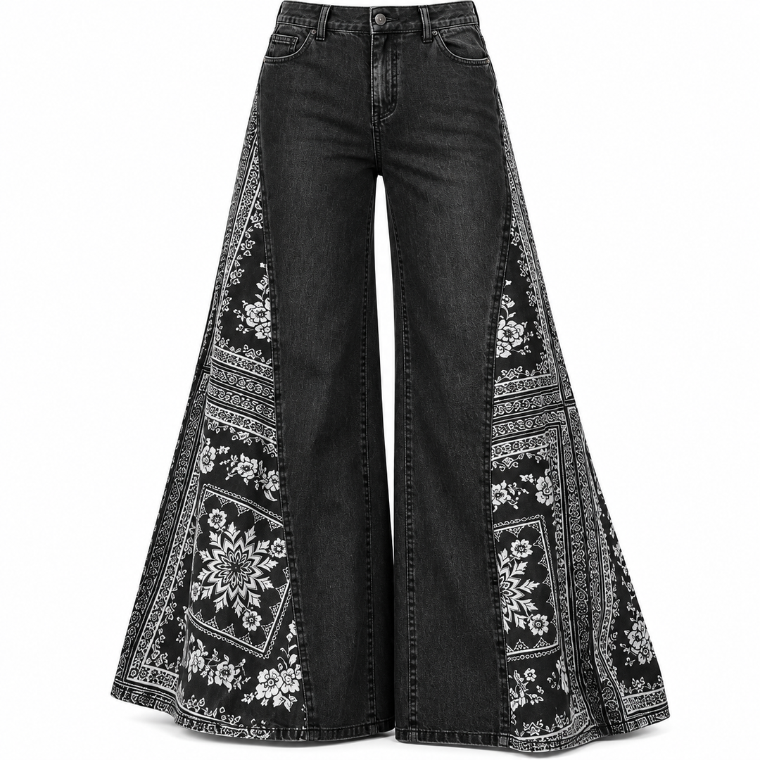 Washed black pants detail showing stitching, wide shape and white bandana-style print