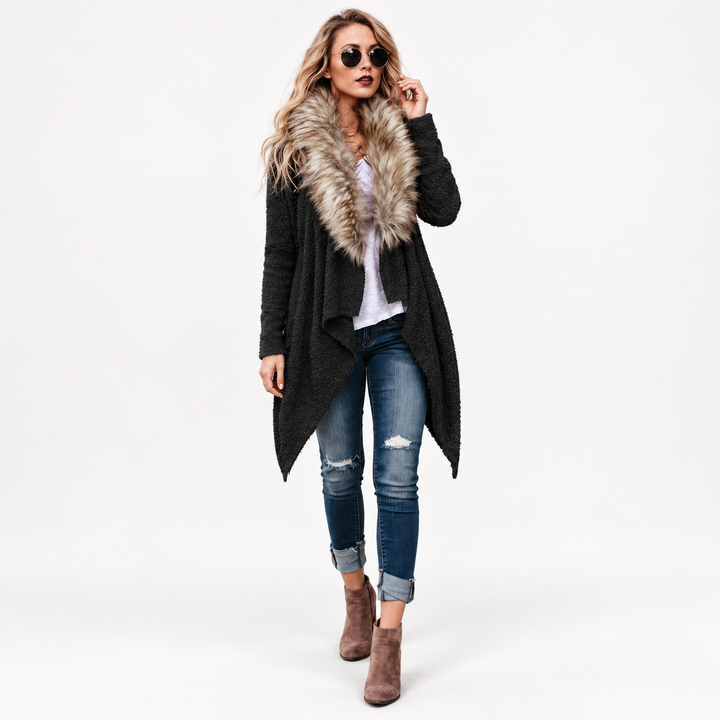 Black open-front cardigan shown on studio model with plush collar, textured body, long sleeves and pointed asymmetric hemline