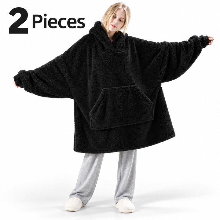 black 2-piece wearable blanket hoodie set on model, oversized hood and front pocket