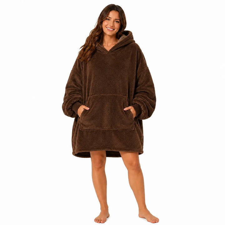 Coffee Brown wearable blanket hoodie with hood and large front pocket modeled by a woman on a clean white studio background.