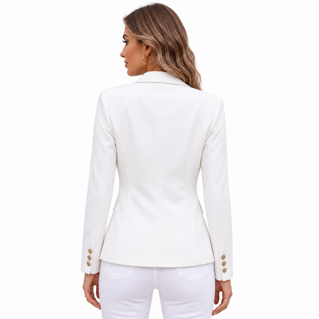 White blazer back view on female model, showing tailored rear seams, shoulder line, long sleeves and clean fitted silhouette.