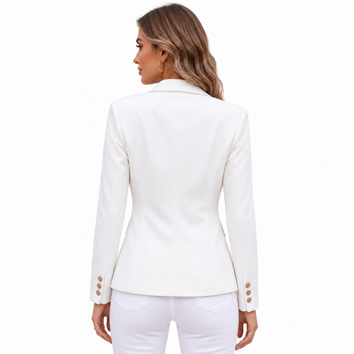 White blazer back view on female model, showing tailored rear seams, shoulder line, long sleeves and clean fitted silhouette.