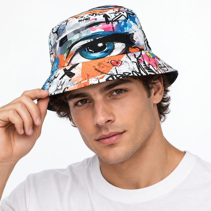 Adult male model wearing the graffiti eye print bucket hat on a clean white studio background, showing the printed front and brim.