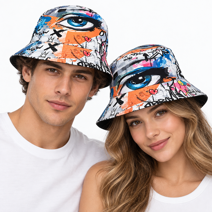 Adult male and female models wearing the graffiti eye print bucket hat together on a clean studio background for unisex styling.