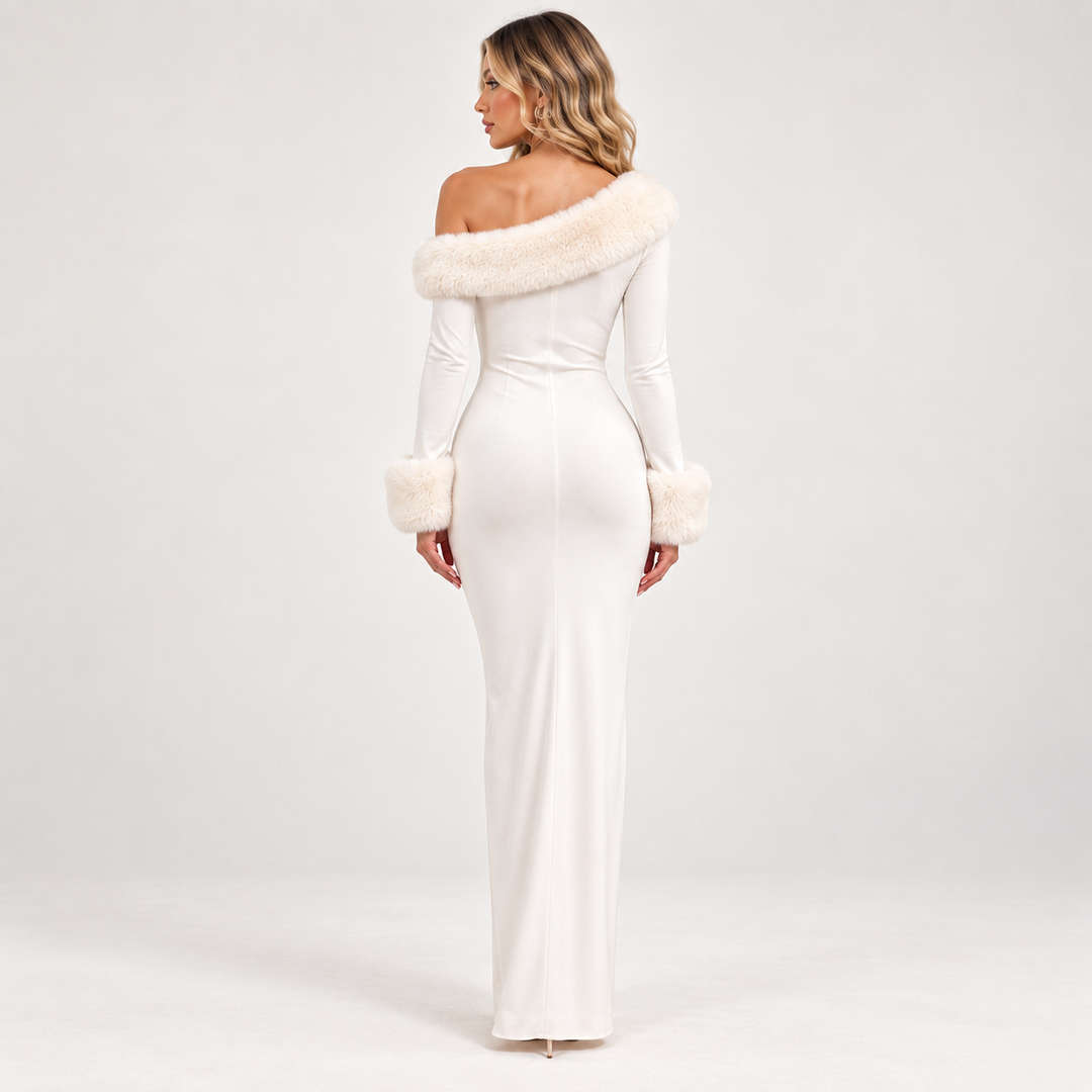 Back view of the white maxi dress showing its full-length silhouette, long sleeves, fluffy cuffs and asymmetric neckline trim.