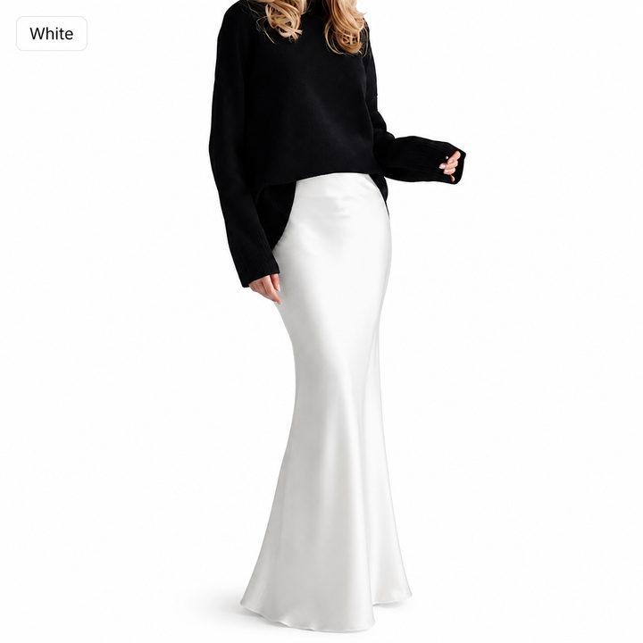 White high-waisted maxi skirt variant on model, shown on a clean studio background with long flowing silhouette and smooth finish.