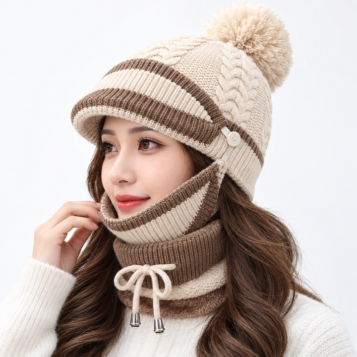 Beige 3-piece winter hat set for women shown from a side angle with knitted beanie, face panel and neck warmer