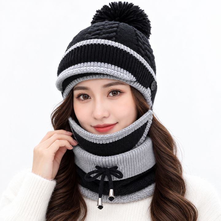 Black winter hat set for women with light gray trim, knitted pom-pom beanie, face cover and neck warmer on model
