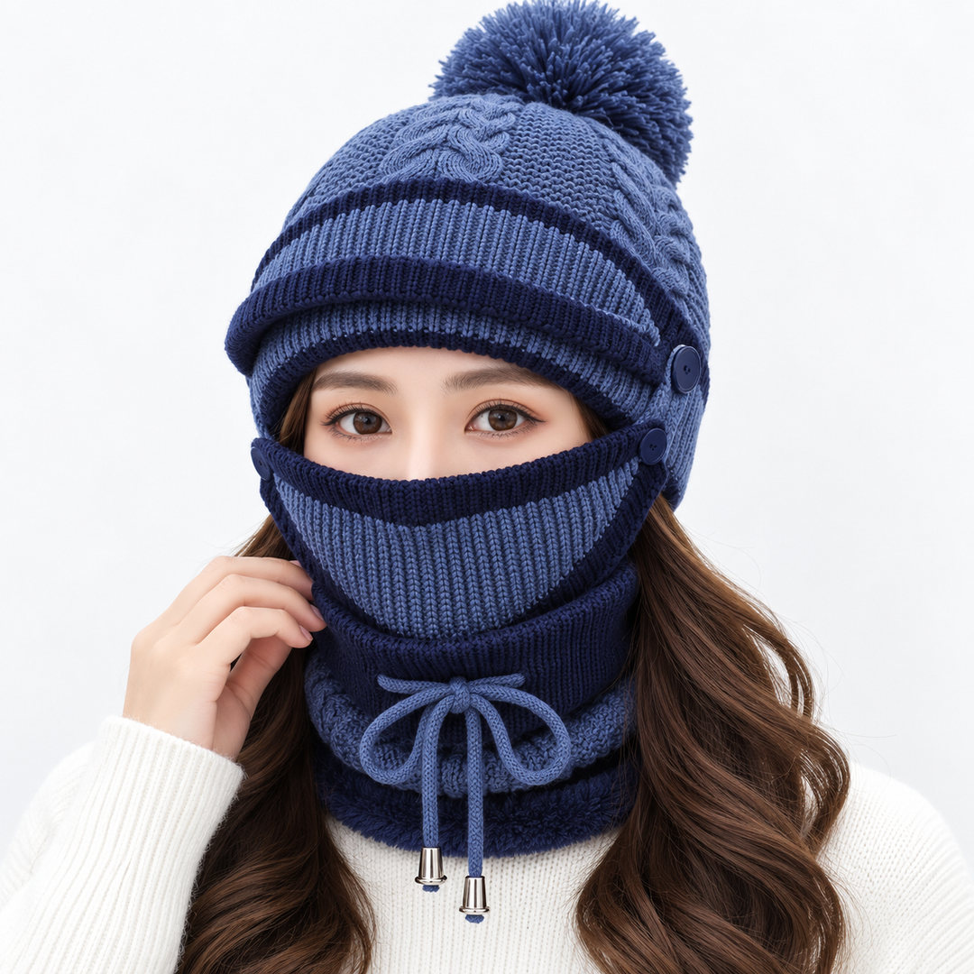 Dark blue winter hat set for women with knitted pom-pom beanie, matching face cover and neck warmer shown on model