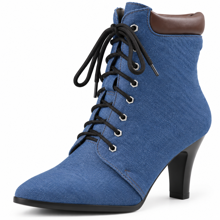 Blue ankle boot close-up showing textile upper, lace-up front, brown collar and black heel