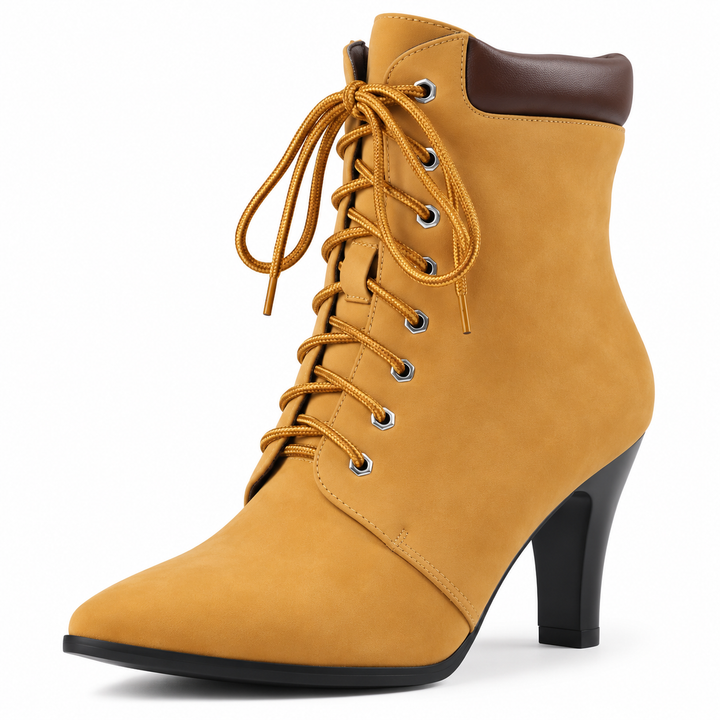 Yellow pointed toe ankle boot close-up showing laces, eyelets, collar and heel