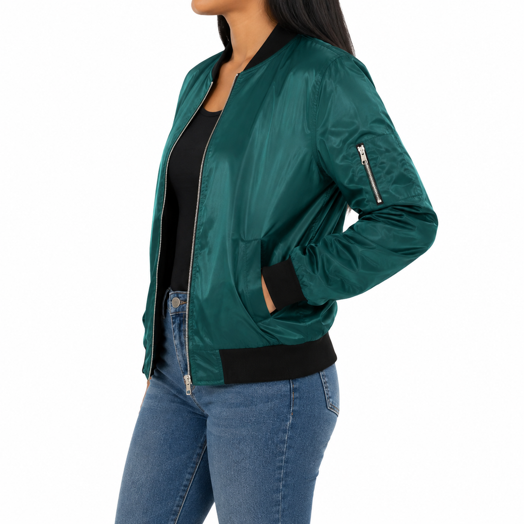 Teal green bomber jacket side view showing fit and shape, black ribbed trim, silver front zipper and upper sleeve zip pocket.