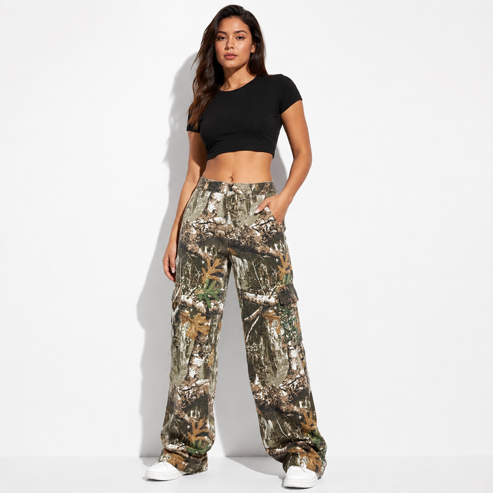 Wide leg camouflage pants for women front view with high waist, cargo pockets, and long denim silhouette on clean background.