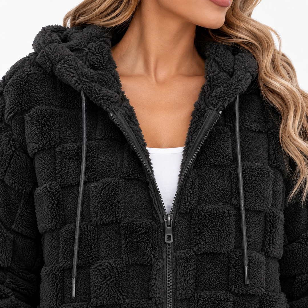 Close-up of the Black plush hooded zip-up cardigan jacket showing the zipper, hood opening, drawstrings and textured surface