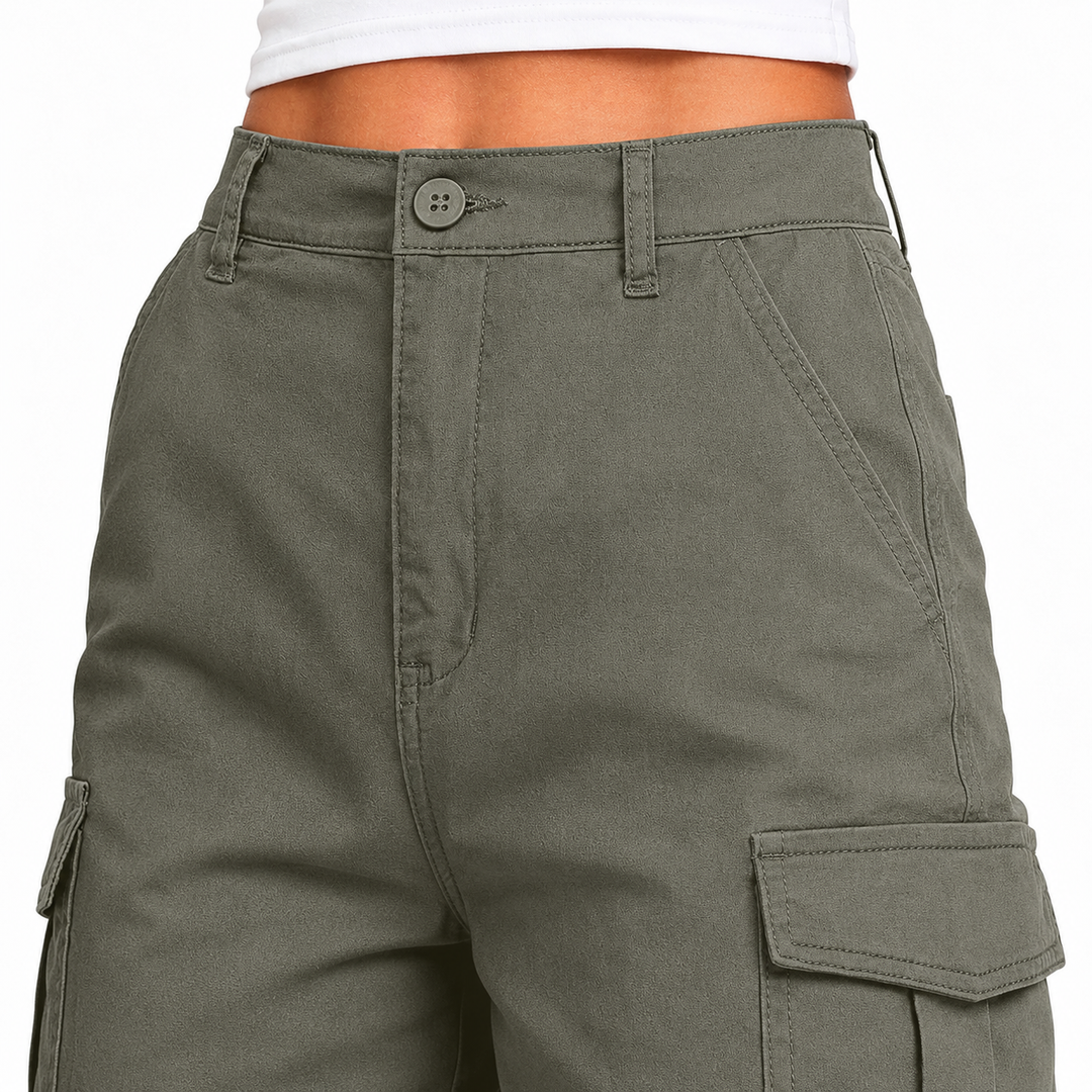 Close-up of army green multi-pocket shorts showing the waistband, button closure, stitching and visible cargo pocket details.