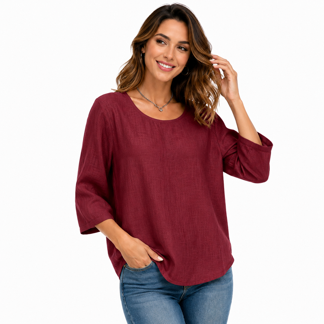 Wine red casual crew neck top with three-quarter sleeves and relaxed silhouette, displayed clearly for product detail online.
