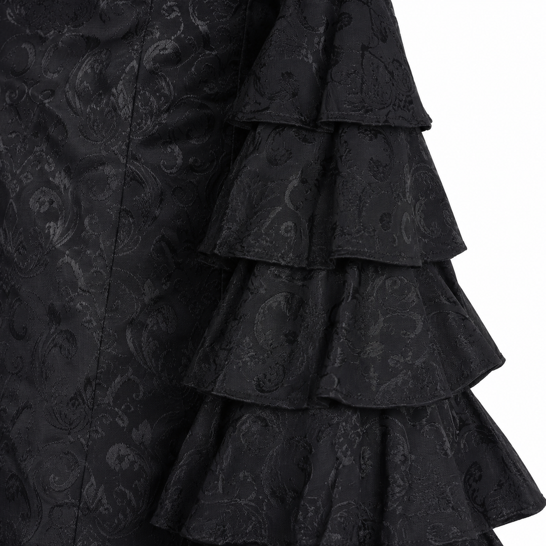 Close-up of black fishtail long skirt layered ruffle detail and textured surface