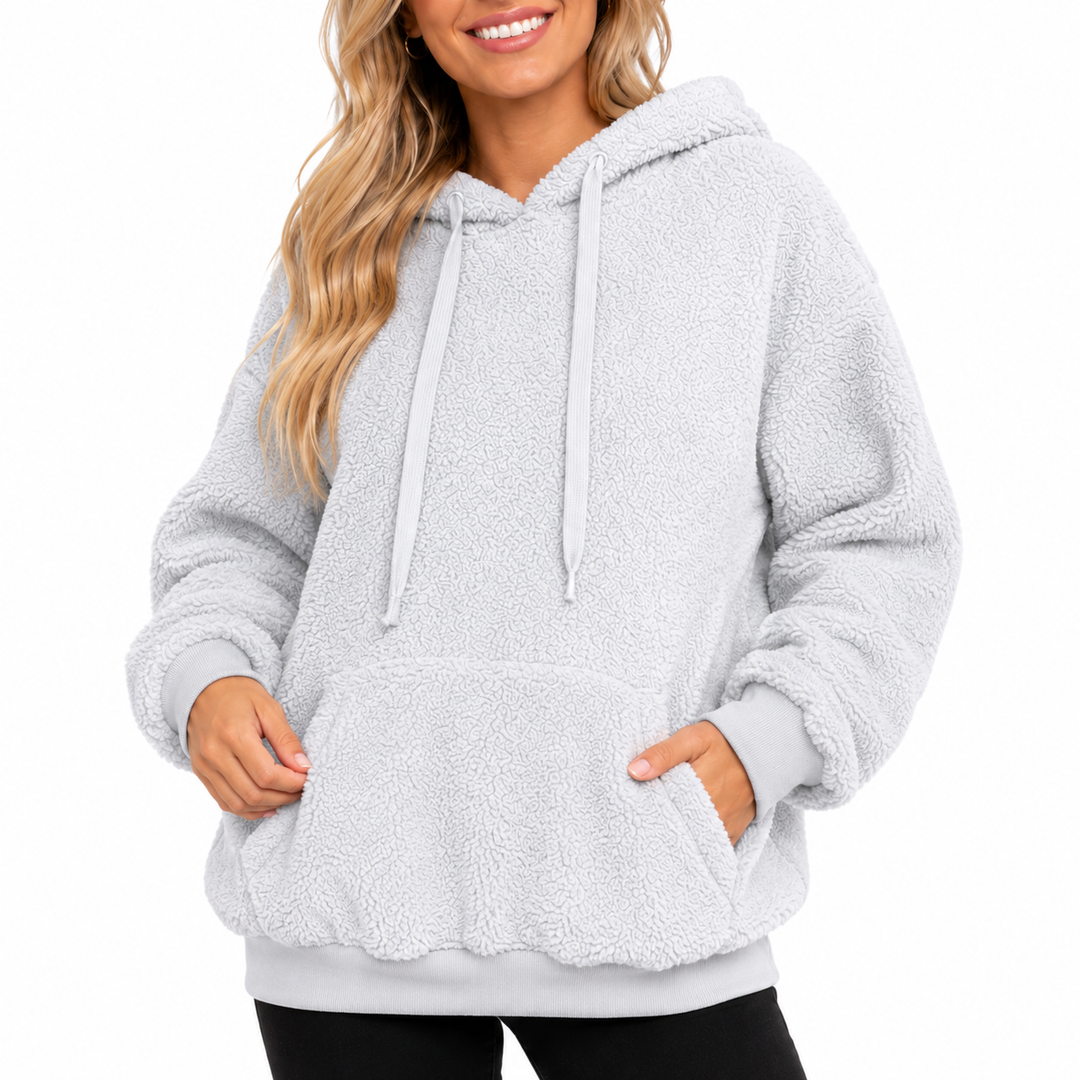 Light gray hooded pullover detail showing fleece texture, kangaroo pocket, ribbed hem and cuffs on a white studio background.