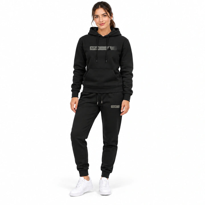 Woman wearing the black hoodie and black pants set on a white background