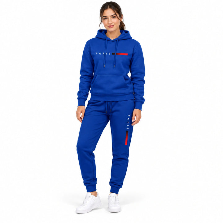 Woman wearing the royal blue hoodie and matching royal blue pants set on a white background