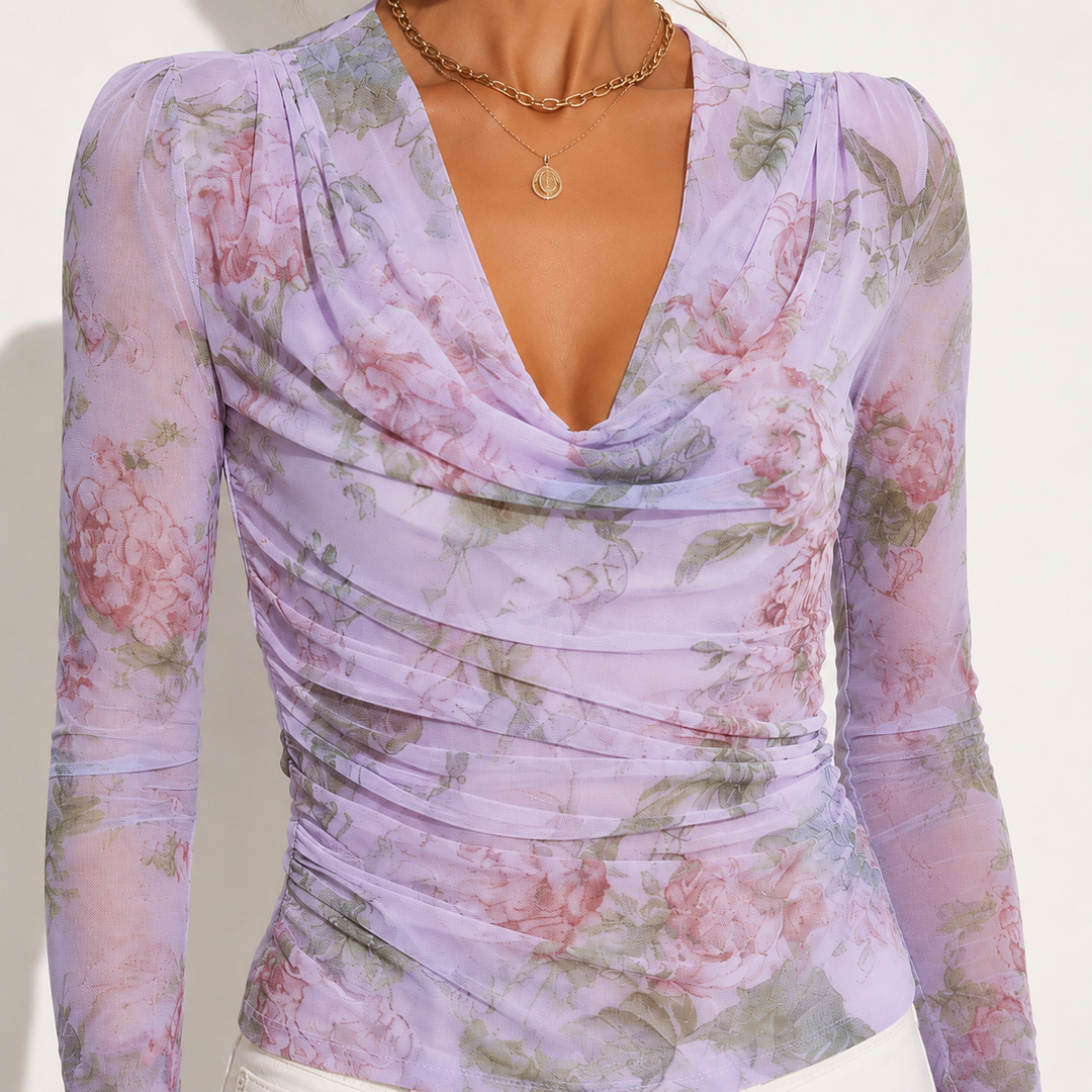 Close-up of Purple floral top highlighting the draped cowl neckline, gathered shoulders and ruched front shaping details now.
