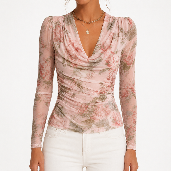 Pink floral long sleeve top shown from front with draped cowl neckline, ruched shaping and fitted silhouette on white studio.