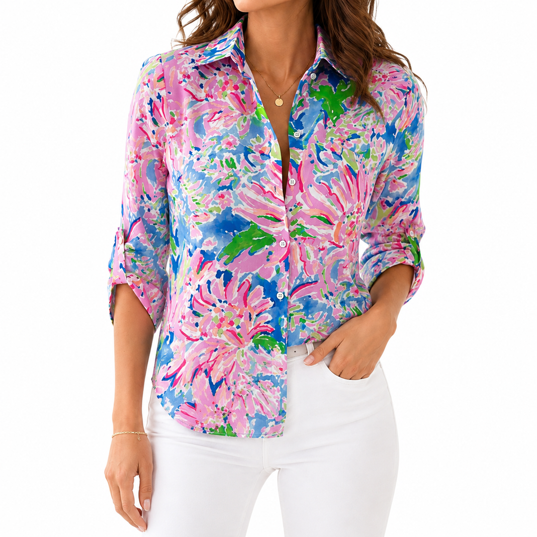 Women's floral summer blouse front product view with pink, blue and green floral print on white background