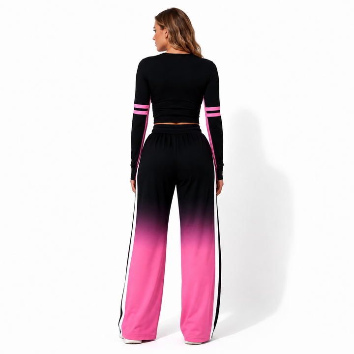Back view of the black-to-pink gradient two piece set showing the cropped top, wide-leg pants and coordinated streetwear look