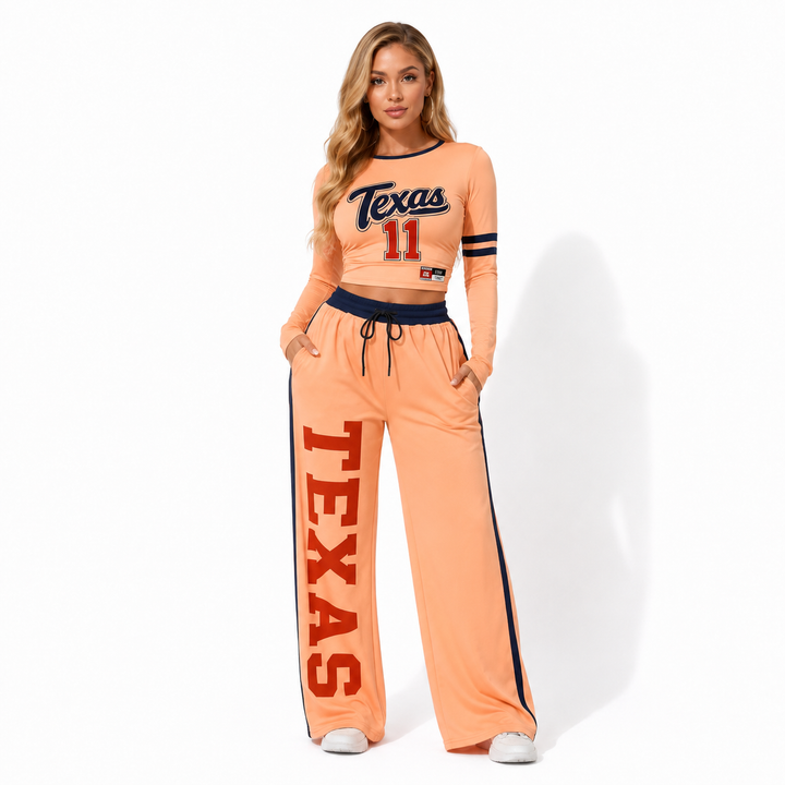 Nude-to-orange gradient two piece outfit in studio pose, showing cropped top, wide-leg pants, and coordinated streetwear look